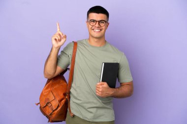Handsome student man over isolated background showing and lifting a finger in sign of the best