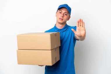 Young delivery Brazilian man isolated ops white background making stop gesture
