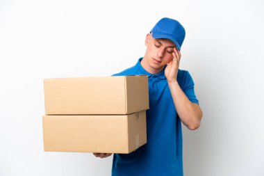 Young delivery Brazilian man isolated ops white background with headache