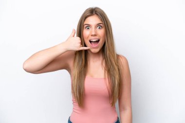 Young caucasian woman isolated on white bakcground making phone gesture. Call me back sign