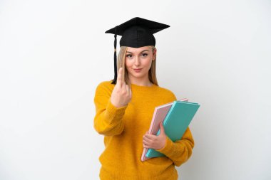 Young student caucasian woman isolated on white background doing coming gesture