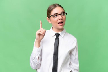 Young business caucasian woman over isolated background intending to realizes the solution while lifting a finger up