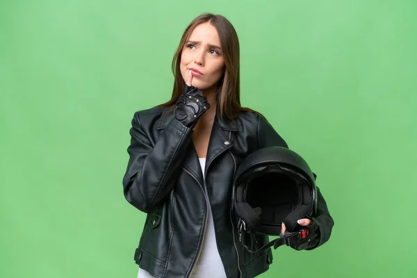 Young Pretty Caucasian Woman Motorcycle Helmet Isolated Background Having Doubts —  Fotos de Stock