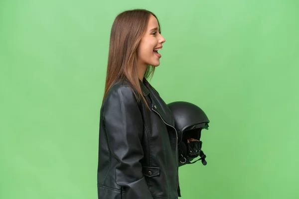 Young Pretty Caucasian Woman Motorcycle Helmet Isolated Background Laughing Lateral —  Fotos de Stock