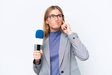 Young TV presenter caucasian woman isolated on white background having doubts and with confuse face expression