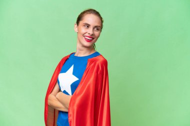 Super Hero caucasian woman over isolated background with arms crossed and happy