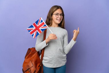 Child holding an United Kingdom flag over isolated background pointing back