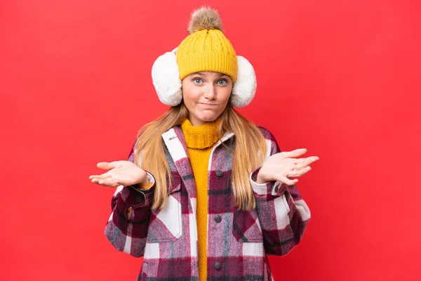 Young Beautiful Woman Wearing Winter Muffs Isolated Red Background Having — Stockfoto