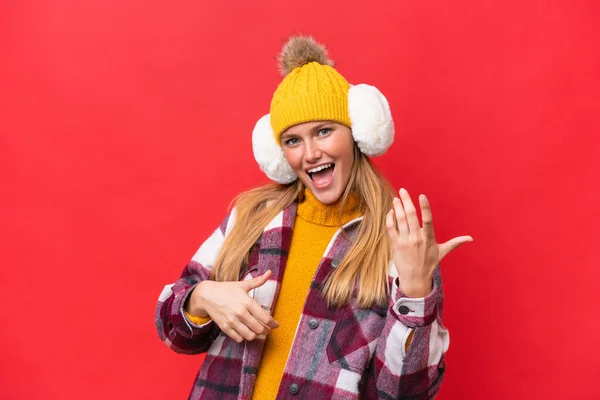 Young Beautiful Woman Wearing Winter Muffs Isolated Red Background Making — Stockfoto