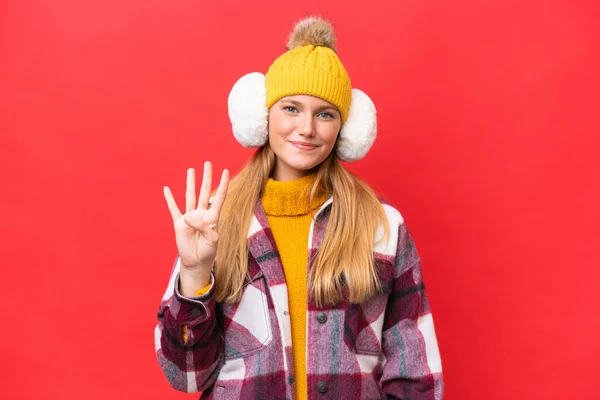 Young Beautiful Woman Wearing Winter Muffs Isolated Red Background Happy — Stockfoto