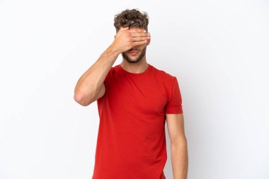 Young caucasian handsome man isolated on white background covering eyes by hands. Do not want to see something