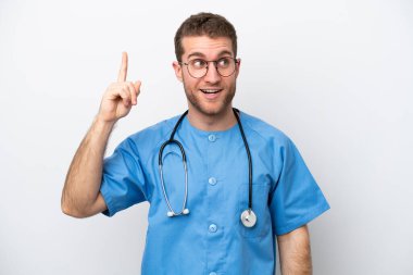 Young surgeon doctor caucasian man isolated on white background intending to realizes the solution while lifting a finger up