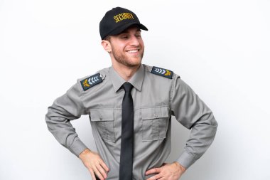 Young safeguard caucasian man isolated on white background posing with arms at hip and smiling
