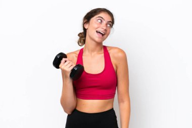 Young sport caucasian woman making weightlifting isolated on white background laughing