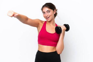 Young sport caucasian woman making weightlifting isolated on white background giving a thumbs up gesture