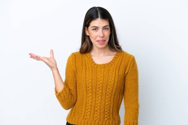 Young Italian woman isolated on white background making doubts gesture