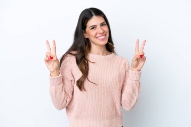 Young Italian woman isolated on white background showing victory sign with both hands