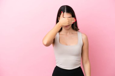 Young Italian woman isolated on pink background covering eyes by hands. Do not want to see something