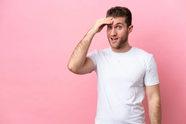 Young Caucasian Man Isolated Pink Background Doing Surprise Gesture While — Stockfoto
