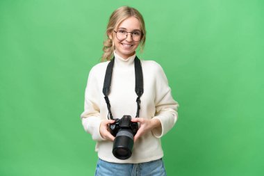 Young photographer English woman over isolated background laughing