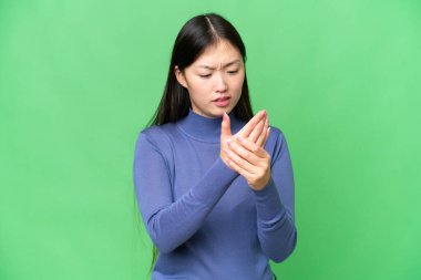Young Asian woman over isolated chroma key background suffering from pain in hands