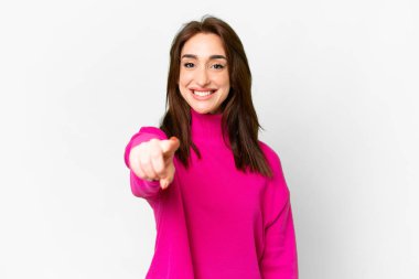 Young caucasian woman over isolated white background points finger at you with a confident expression
