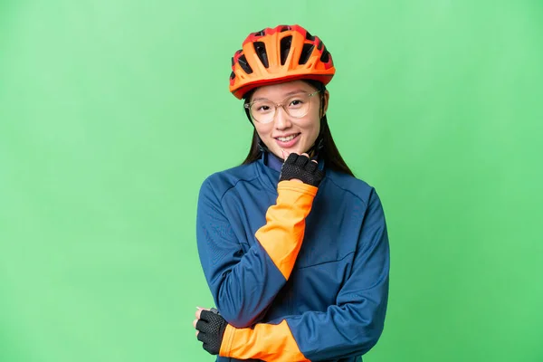 Young Cyclist Woman Isolated Chroma Key Background Glasses Smiling — Stockfoto