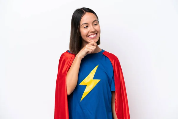 Super Hero caucasian woman isolated on white background looking to the side
