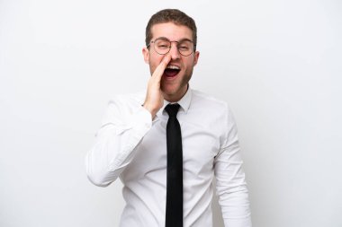 Young business caucasian man isolated on white background shouting with mouth wide open