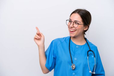 surgeon doctor woman holding tools isolated on white background pointing finger to the side and presenting a product