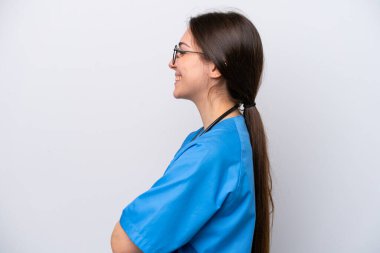 surgeon doctor woman holding tools isolated on white background in lateral position