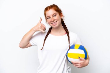 Young caucasian reddish woman playing volleyball isolated on white background making phone gesture. Call me back sign