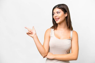 Young Russian woman over isolated white background pointing finger to the side and presenting a product