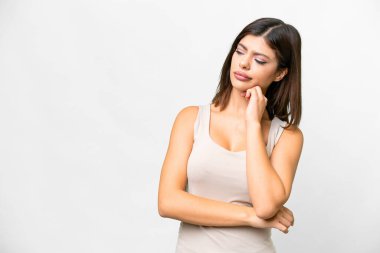 Young Russian woman over isolated white background with tired and bored expression