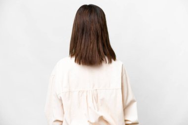 Young Russian woman over isolated white background in back position
