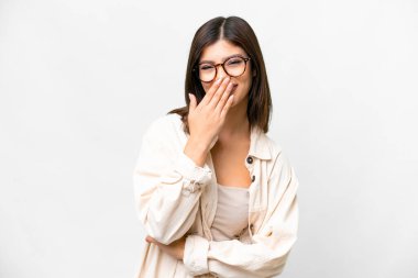 Young Russian woman over isolated white background happy and smiling covering mouth with hand