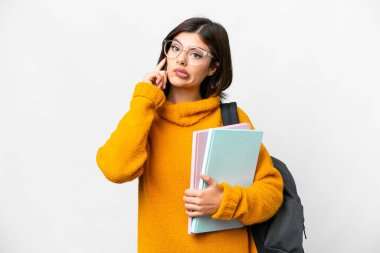 Young student woman over isolated white background thinking an idea