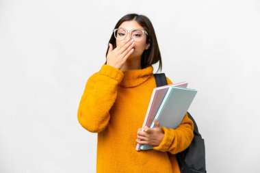 Young student woman over isolated white background happy and smiling covering mouth with hand
