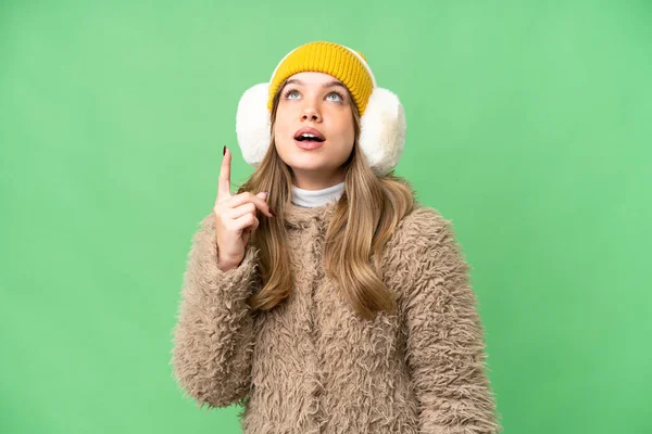 Young Girl Wearing Winter Muffs Isolated Chroma Key Background Pointing — Stock Photo, Image