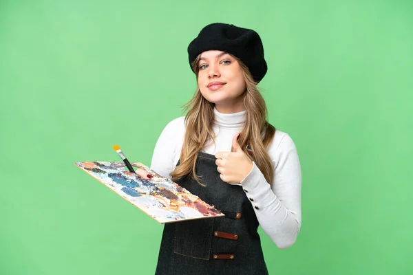 Junges Künstlermädchen Mit Einer Palette Über Isoliertem Chroma Schlüsselhintergrund Und — Stockfoto