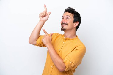 Young man with moustache isolated on white background pointing with the index finger a great idea