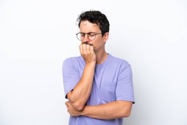 Young man with moustache isolated on white background having doubts