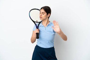 Handsome young tennis player caucasian woman isolated on white background making stop gesture and disappointed