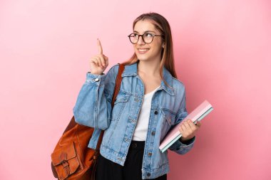 Young caucasian student woman isolated on pink background pointing up a great idea