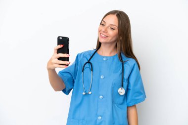 Young surgeon doctor Lithuanian woman isolated on white background making a selfie