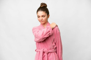 Teenager girl in a bathrobe over isolated white background suffering from pain in shoulder for having made an effort