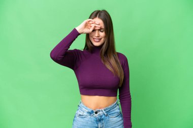 Young beautiful woman over isolated chroma key background with tired and sick expression