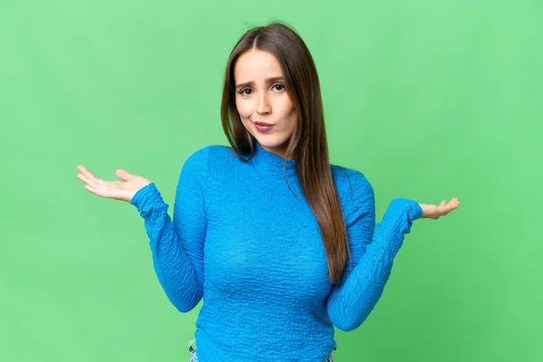 Young Beautiful Woman Isolated Chroma Key Background Having Doubts While — Stockfoto