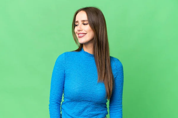 Young Beautiful Woman Isolated Chroma Key Background Looking Side Smiling — Stockfoto
