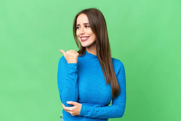 Young Beautiful Woman Isolated Chroma Key Background Pointing Side Present — Stockfoto